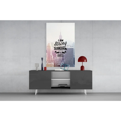 Modern gray console table with white legs and glass wall art prints