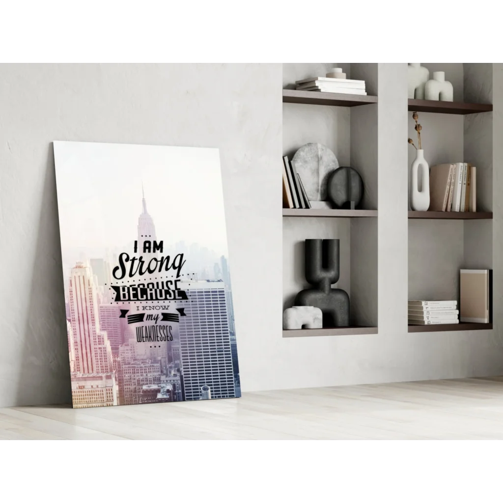 Motivational glass wall art print of cityscape with strength quote