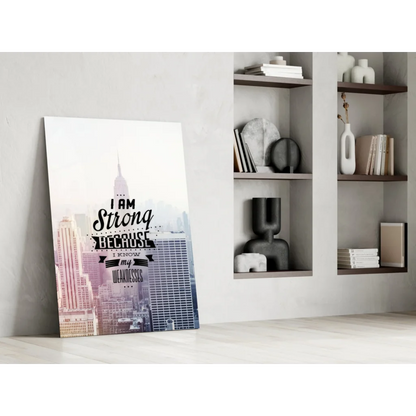 Motivational glass wall art print of cityscape with strength quote