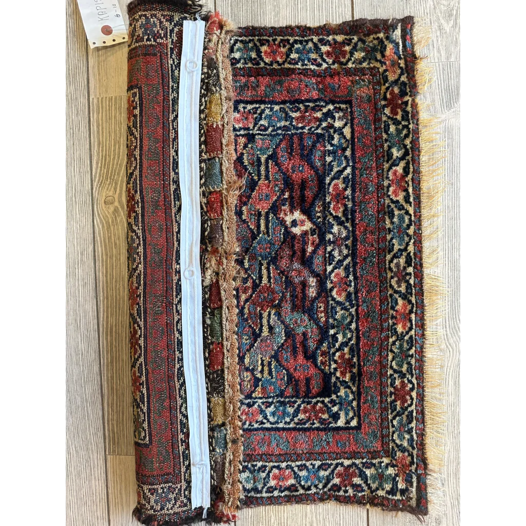 Vintage 1900s Persian hanging rug with intricate floral and geometric patterns in reds and blues