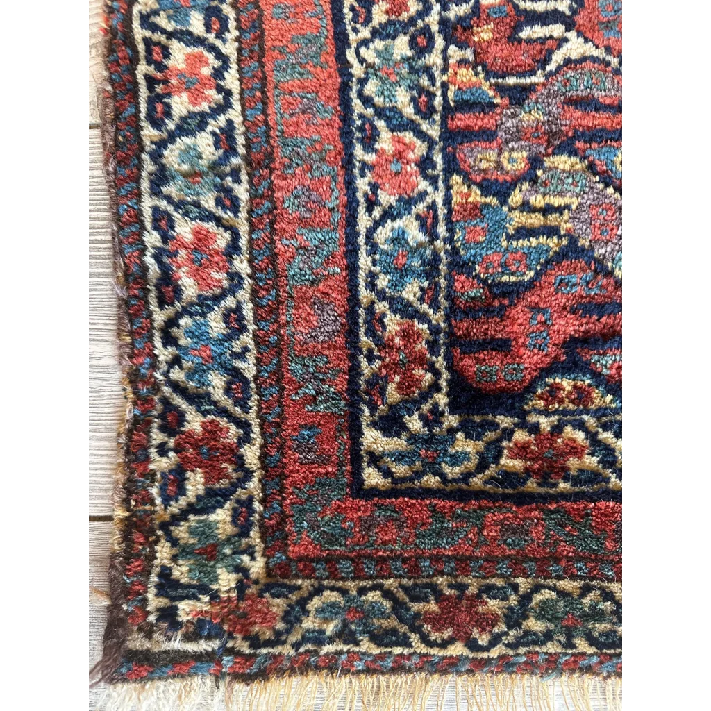 Antique 1900s Persian decorative hanging rug with floral motifs, square format with attached hanger