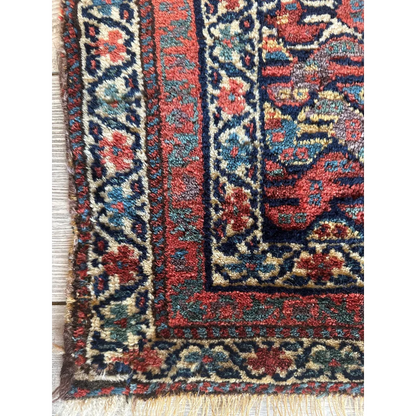 Antique 1900s Persian decorative hanging rug with floral motifs, square format with attached hanger