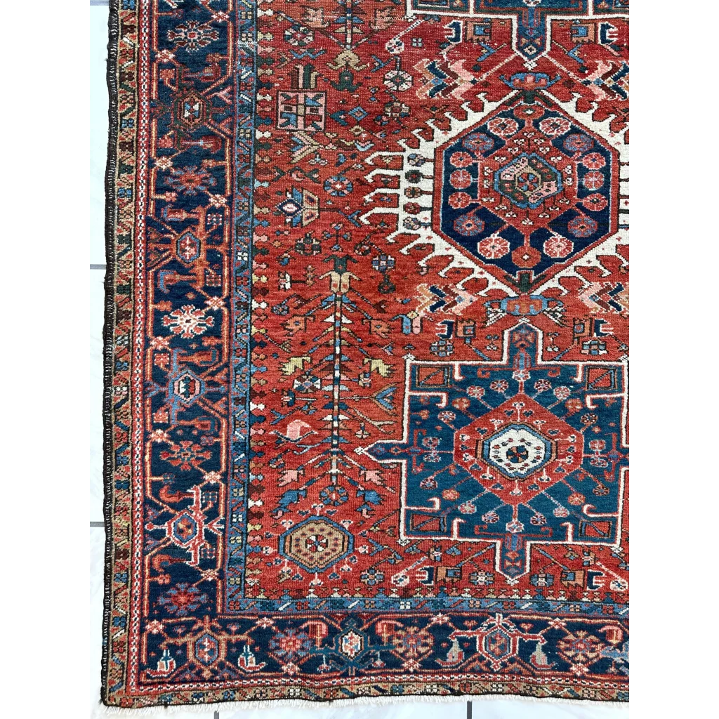 Vibrant red and blue 1900s Persian Karaja rug with bold medallion