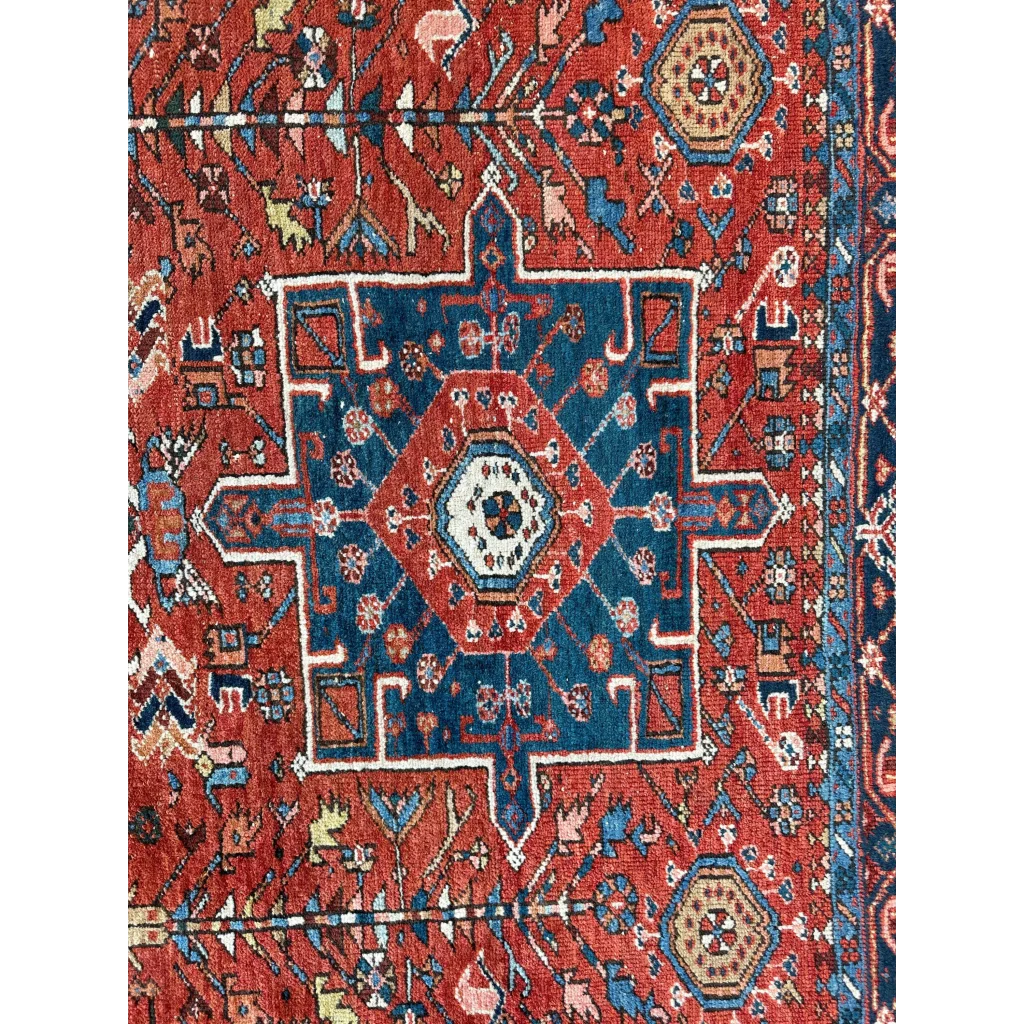 Vibrant 1900s Persian Karaja rug in red and blue with bold medallion