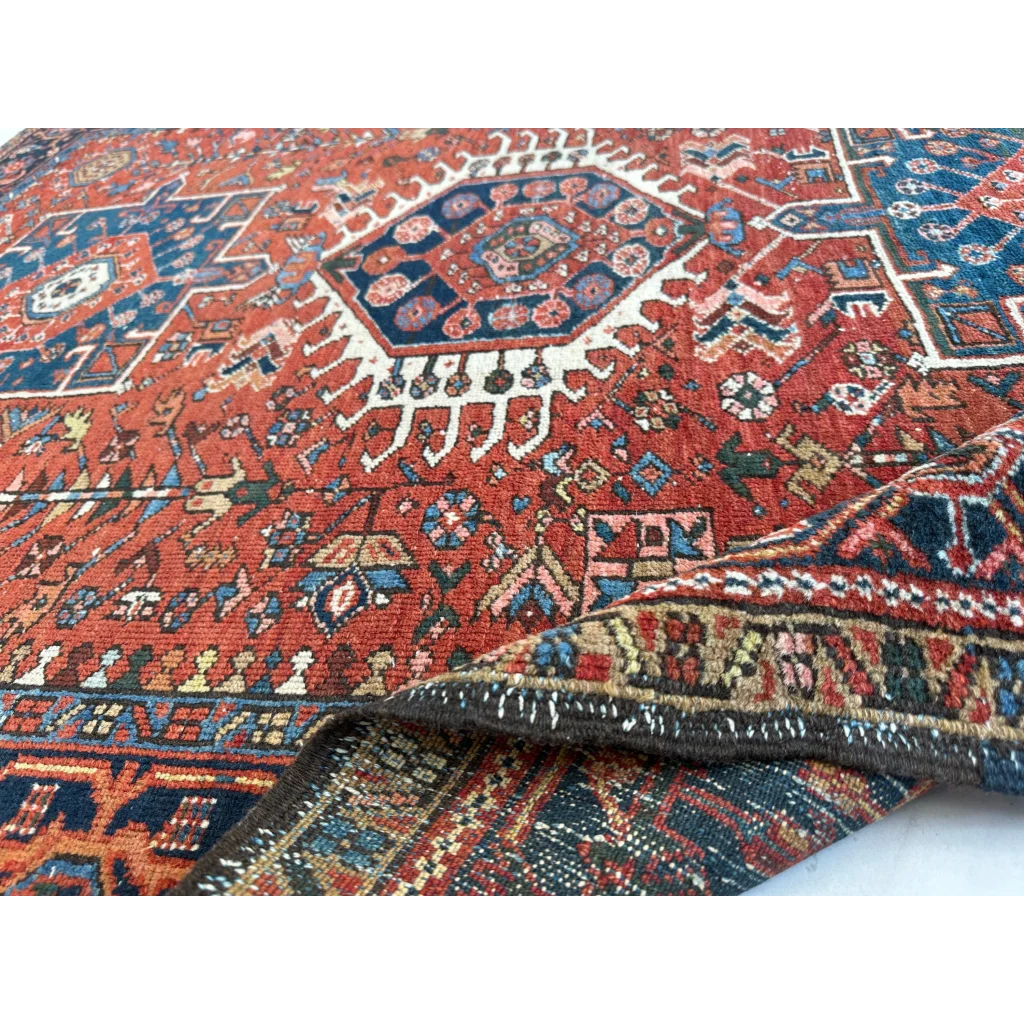 Vibrant 1900s Persian Karaja rug in red and blue with bold medallion