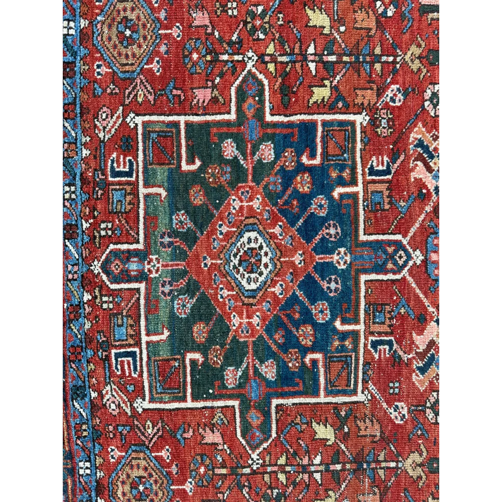 Vibrant 1900s Persian Karaja rug with bold red medallion and geometric patterns