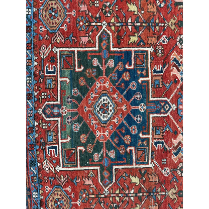 Vibrant 1900s Persian Karaja rug with bold red medallion and geometric patterns