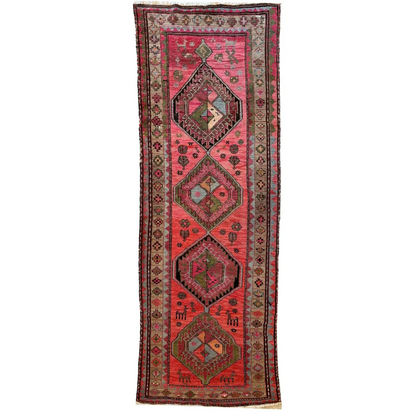 1910s Caucasian runner rug, vibrant natural dyes, pink red geometric patterns with authentic abrash