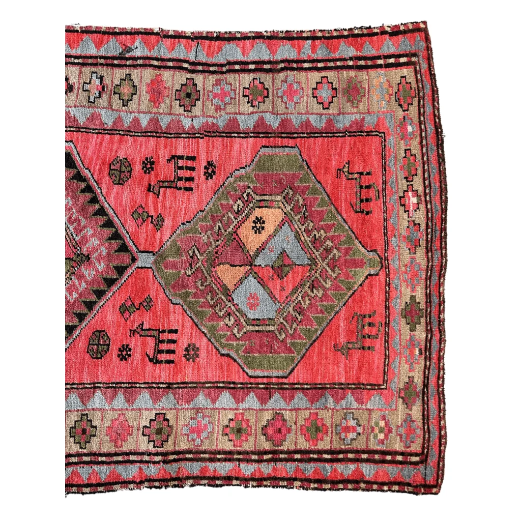 1910s Caucasian runner rug with vibrant natural dyes and geometric animal motifs, hand-knotted wool