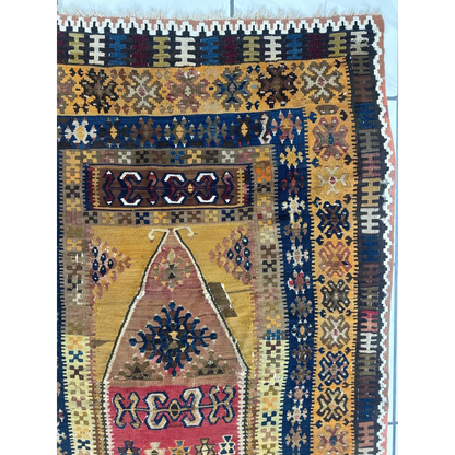 Vibrant 1920s antique Anatolian wool prayer rug with geometric patterns