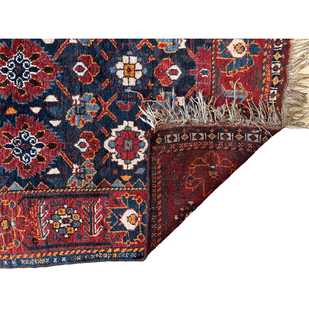 1920s Khamseh Southwest Persian rug, side view showing hand-knotted wool construction and pile
