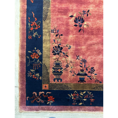 Vibrant 1920s Chinese art deco rug with pink field and floral vase motifs