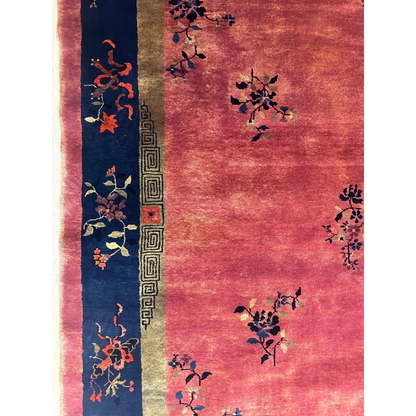 Stunning 1920s Chinese art deco rug with pink floral patterns and blue border