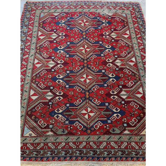 Stunning 1920s Persian Soumak rug in red with natural dyes and intricate motifs