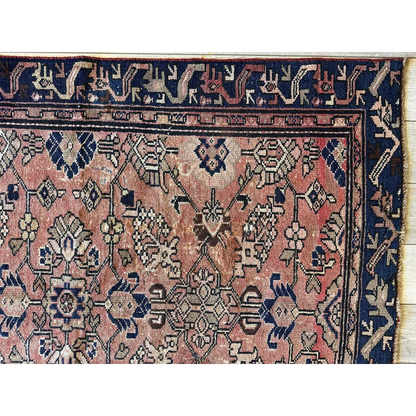 Stunning 1930s Persian Lilihan runner with faded pink, navy, and beige patterns