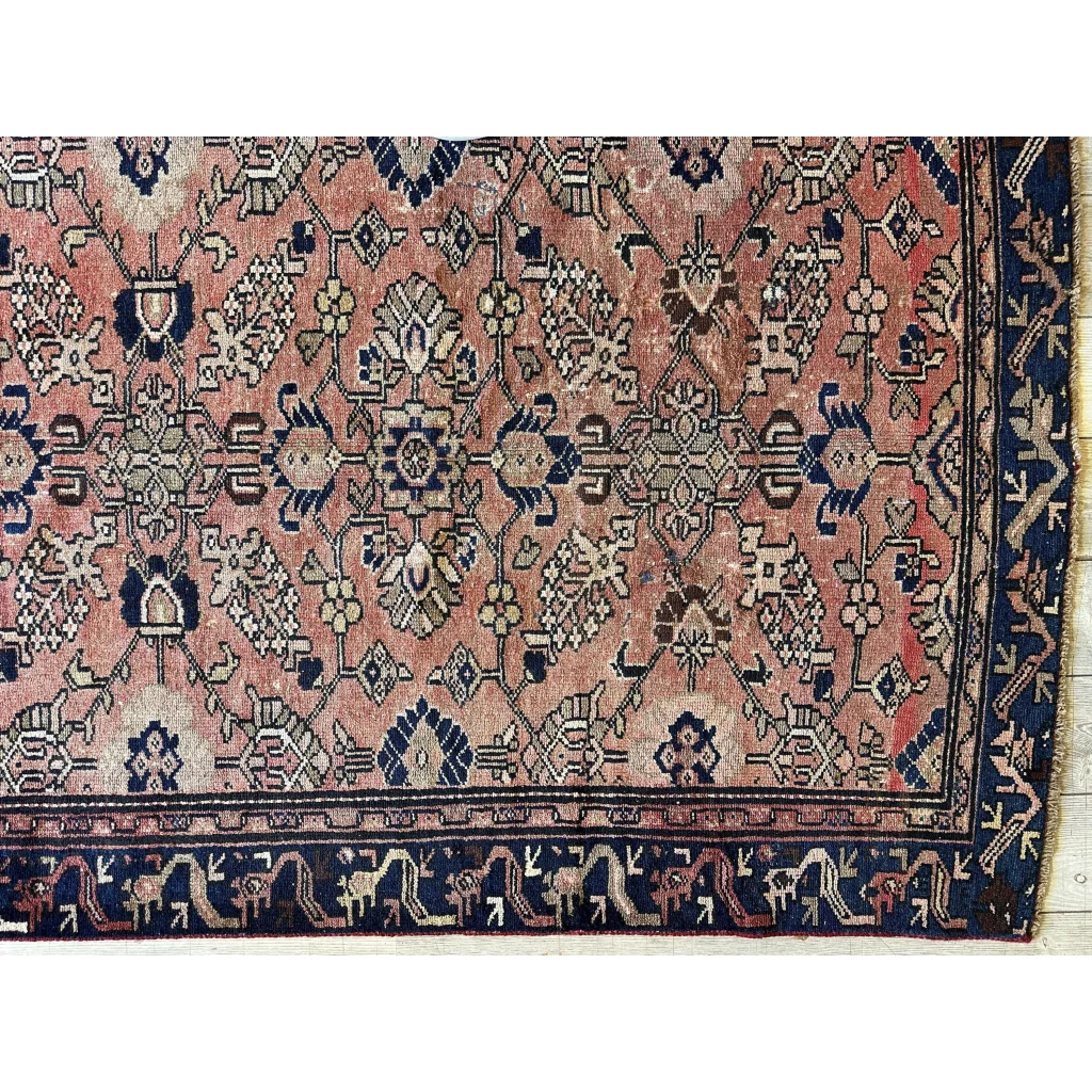 Stunning 1930s Persian Lilihan runner with faded pink field and navy patterns