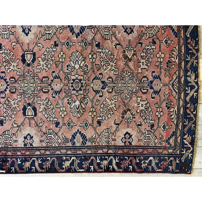 Stunning 1930s Persian Lilihan runner with faded pink field and navy patterns