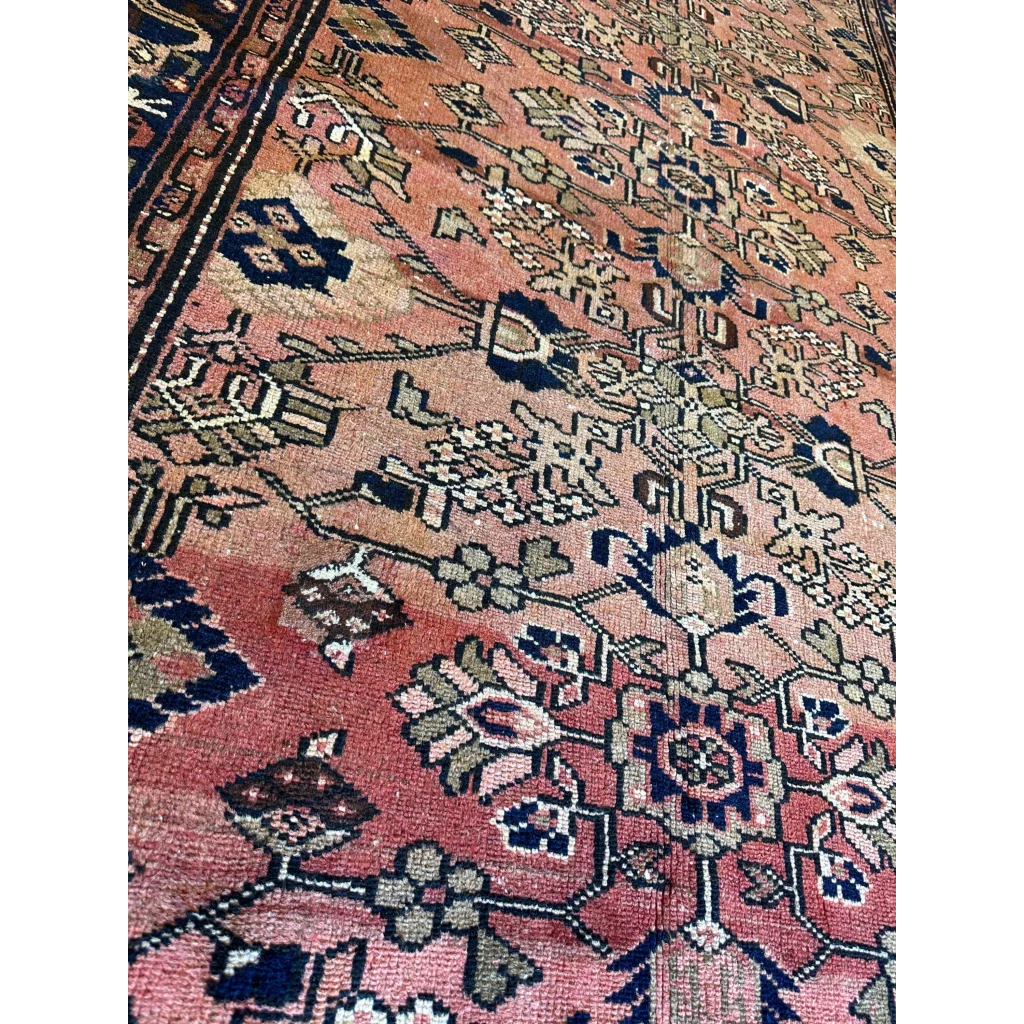 Vintage 1930s Persian Lilihan runner in faded pink with navy geometric floral patterns