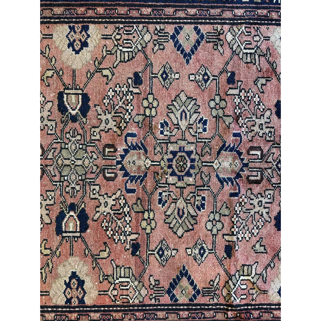 Vintage 1930s Persian Lilihan runner in faded pink with navy geometric floral patterns