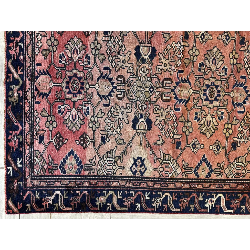 Vintage 1930s Persian Lilihan runner with faded pink coral and navy geometric patterns