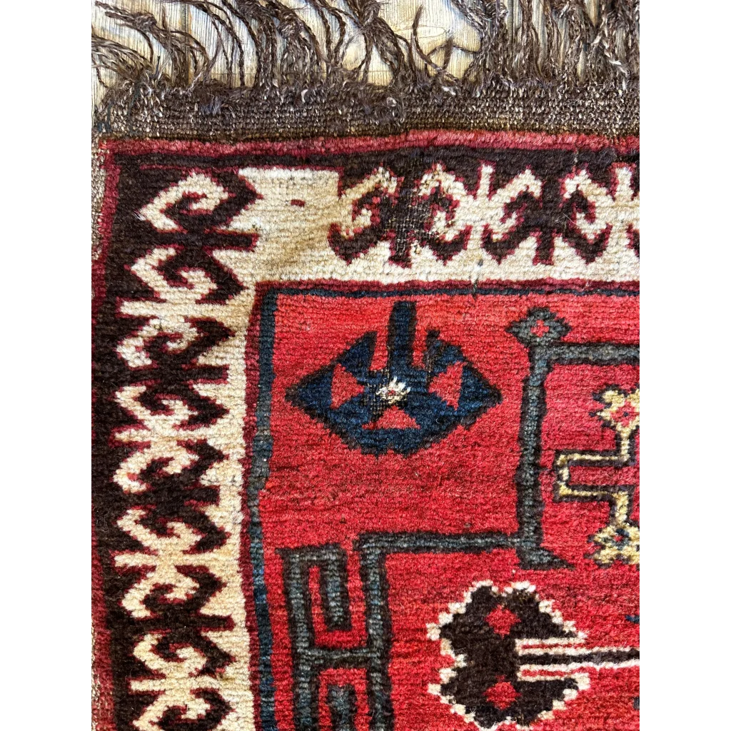 Vintage 1950s Persian tribal bagface rug with bold geometric patterns in natural wool pile