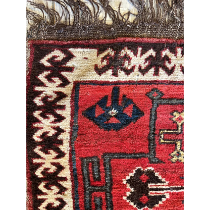 Vintage 1950s Persian tribal bagface rug with bold geometric patterns in natural wool pile