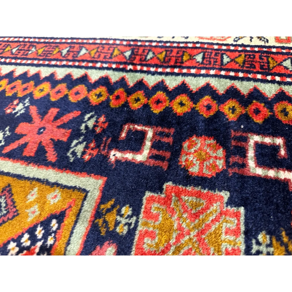 Vibrant 1960s Armenian Karabakh Artsakh handwoven rug in navy with floral motifs