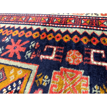 Vibrant 1960s Armenian Karabakh Artsakh handwoven rug in navy with floral motifs