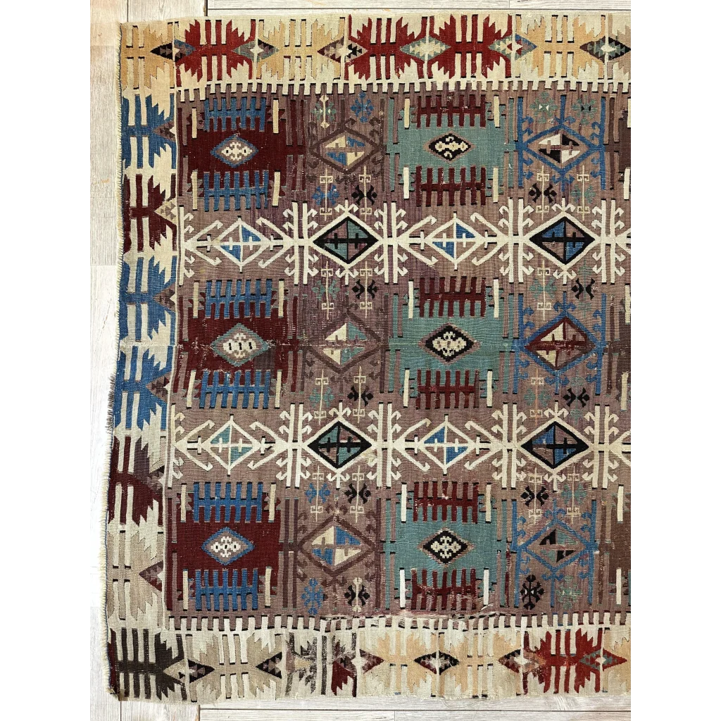 Stunning 19th century Turkish Reyhanli kilim rug with intricate geometric patterns in earthy brown, blue, red, and cream tones