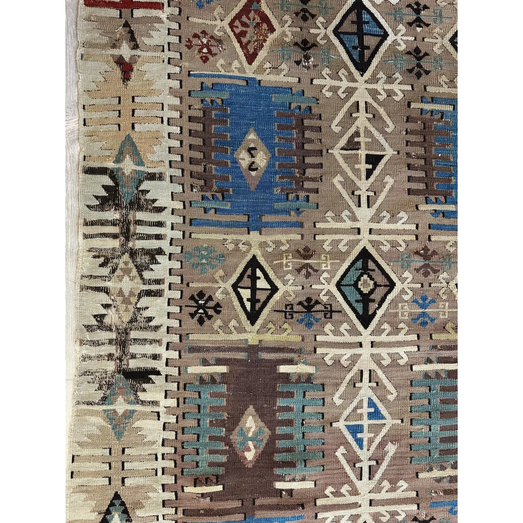 Stunning 19th century Turkish Reyhanli kilim rug with intricate geometric patterns in earthy brown, blue, and black tones