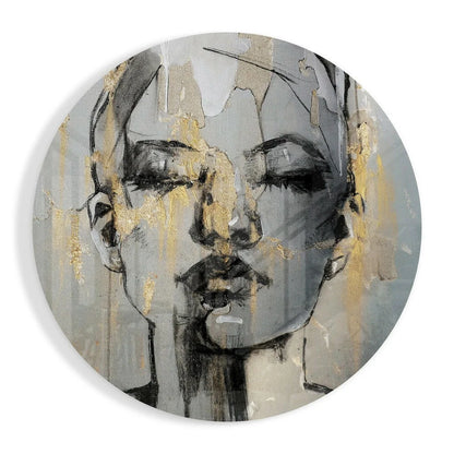 Round metallic plate with abstract face on tempered glass art, gold accents