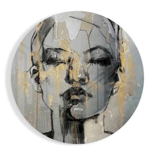Round metallic plate with abstract face on tempered glass art, gold accents