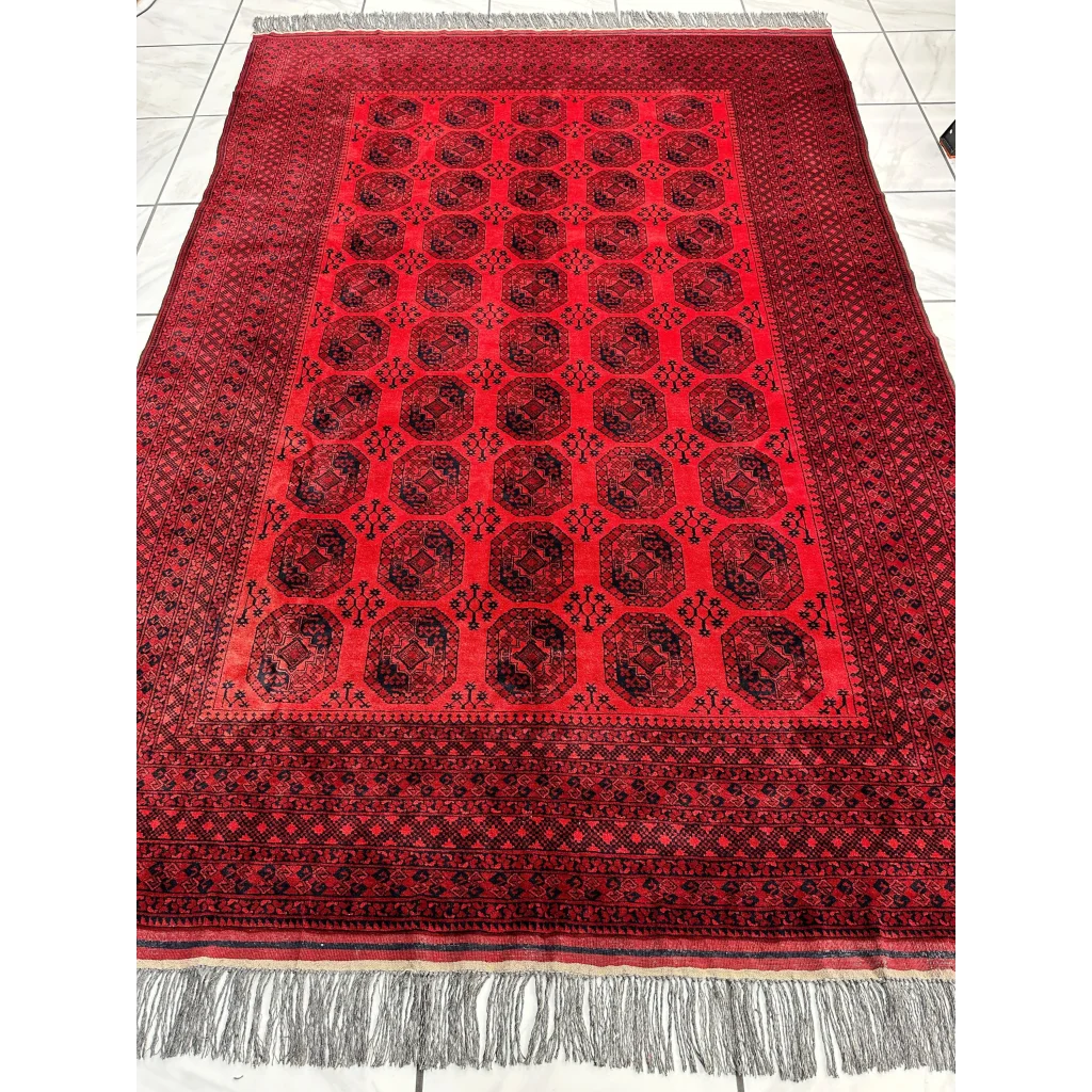 Afghan Ersari rug in deep red tones with geometric octagonal gul motifs