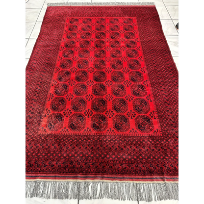 Afghan Ersari rug in deep red tones with geometric octagonal gul motifs