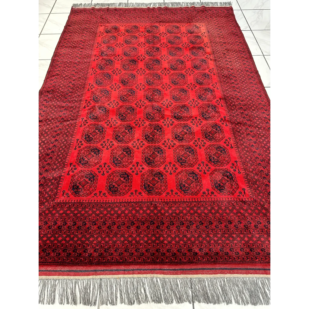 Afghan Ersari hand-knotted rug in rich red tones with black geometric patterns