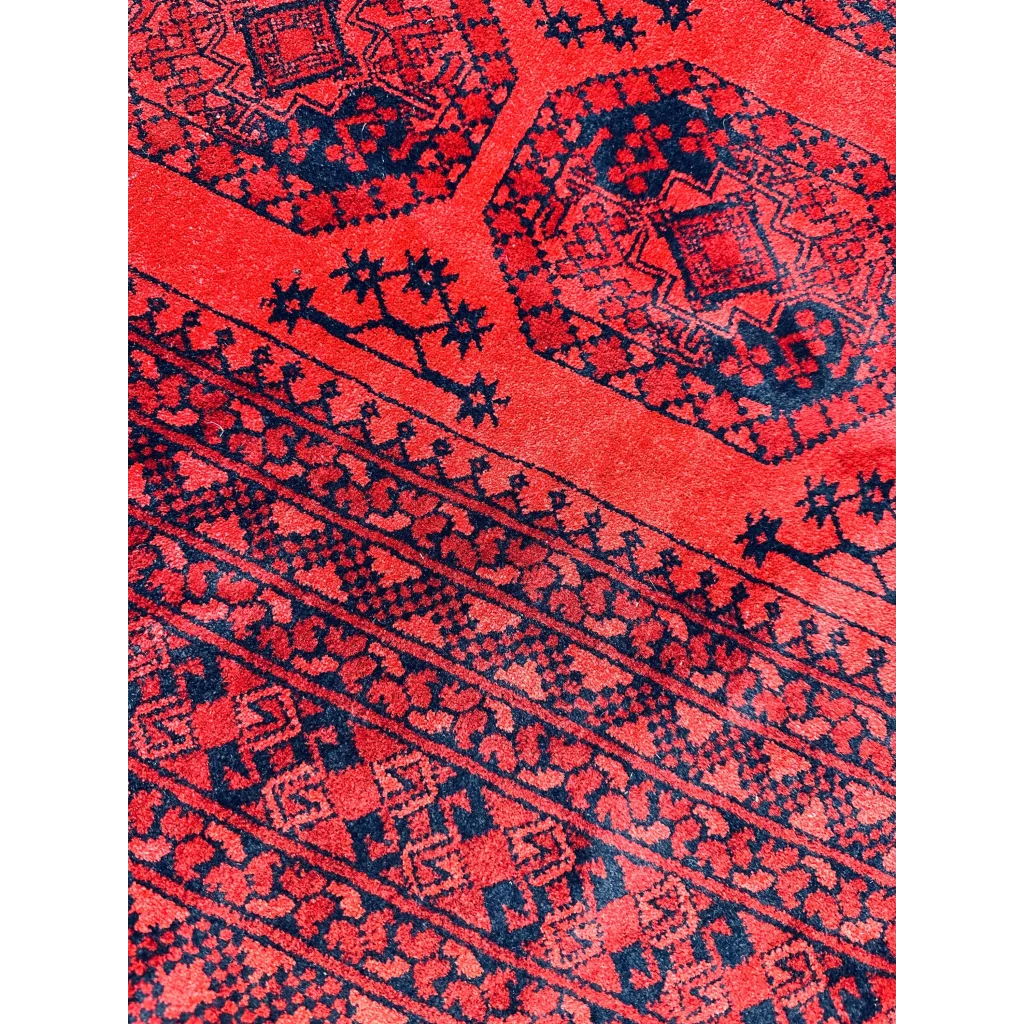Afghan Ersari rug in deep red tones with blue geometric patterns