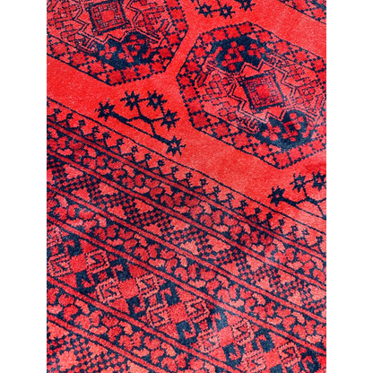 Afghan Ersari rug in deep red tones with blue geometric patterns