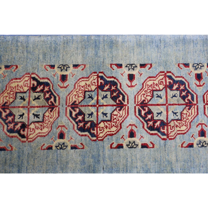 Stunning Afghan Kazak runner rug in blue with red geometric patterns on cotton foundation
