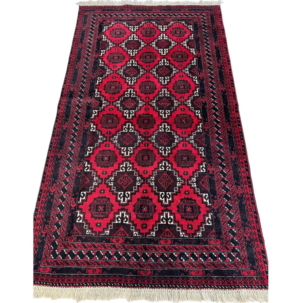 Afghan Baluch hand-knotted wool rug with dark red and black geometric motifs
