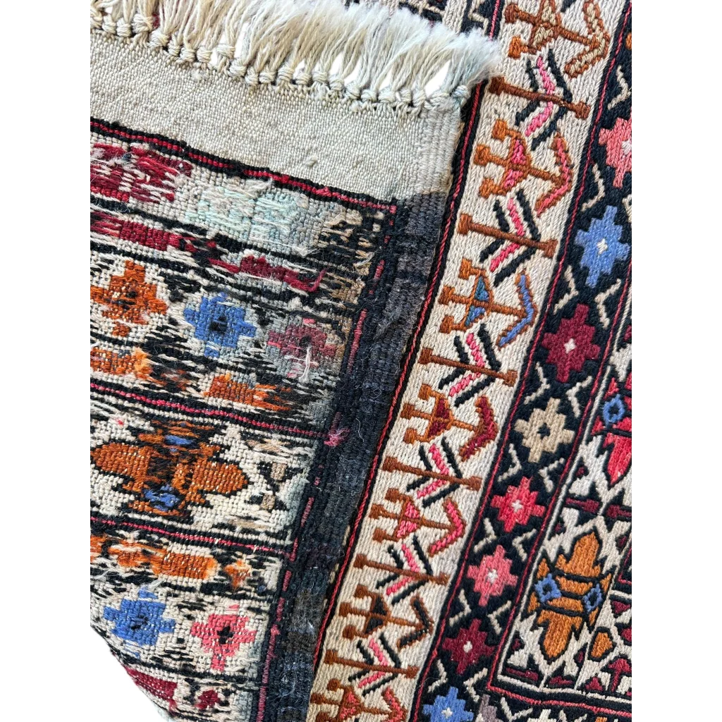 Vibrant Afghani Maliki Soumak rug with bold geometric patterns