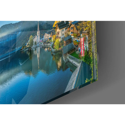 Sleek glass wall art of alpine village with mountain lake reflection