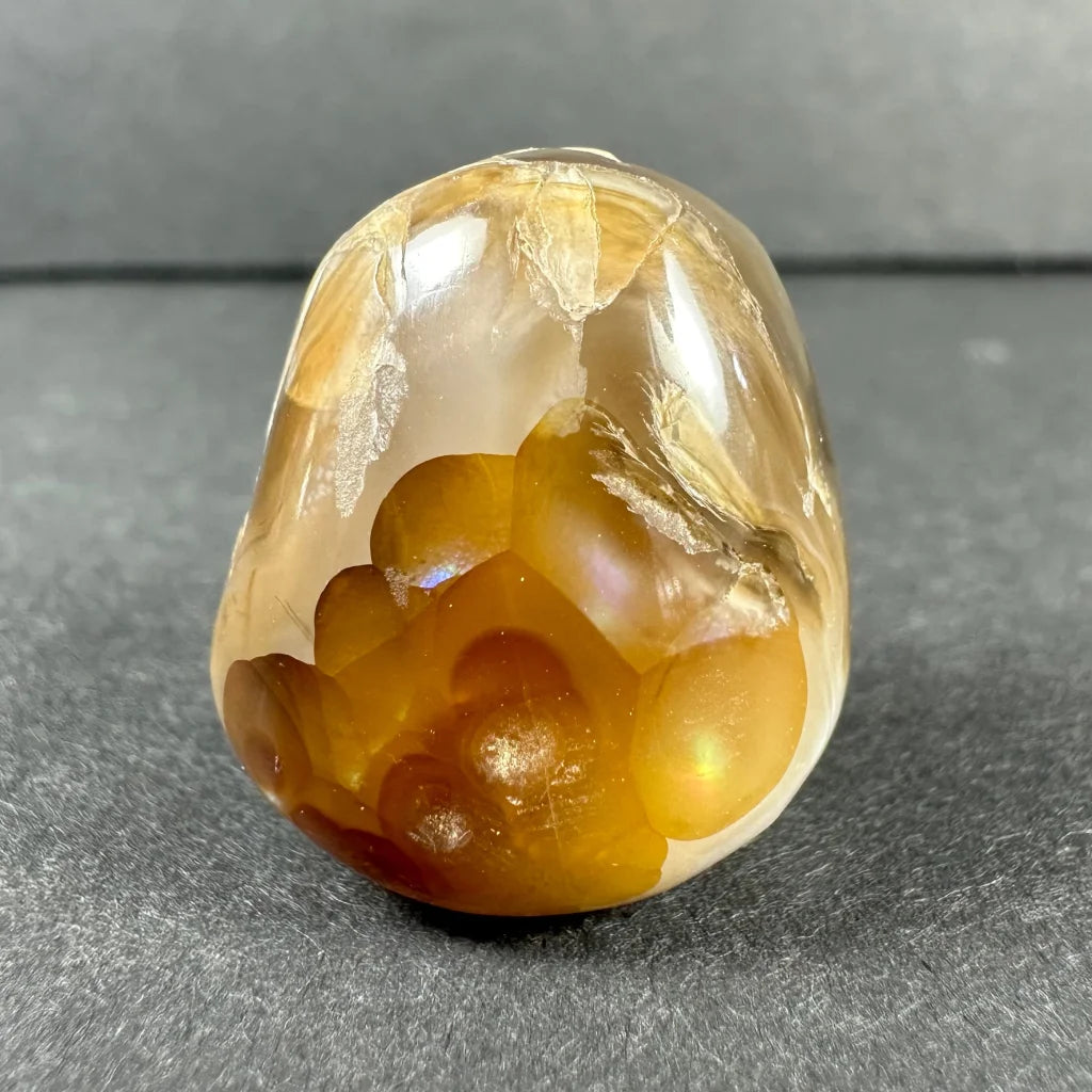 Stunning amber agate geode with golden swirls and crystals