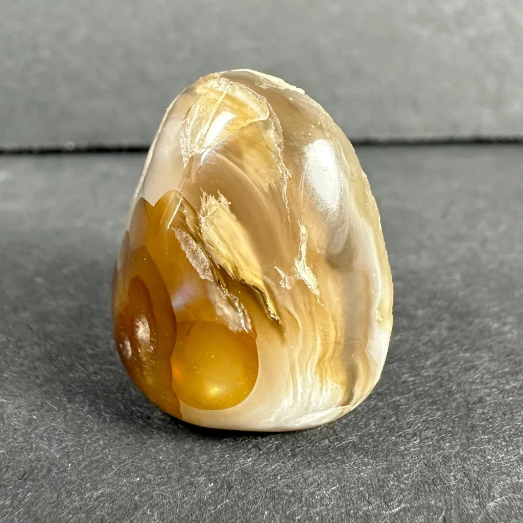 Stunning amber agate gemstone with golden swirls