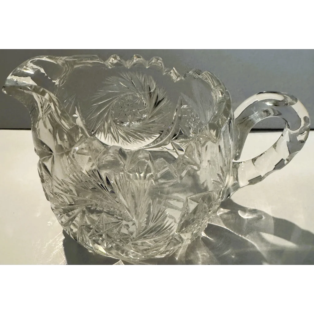 American brilliant cut glass creamer with starburst and geometric pattern from Gilded Age