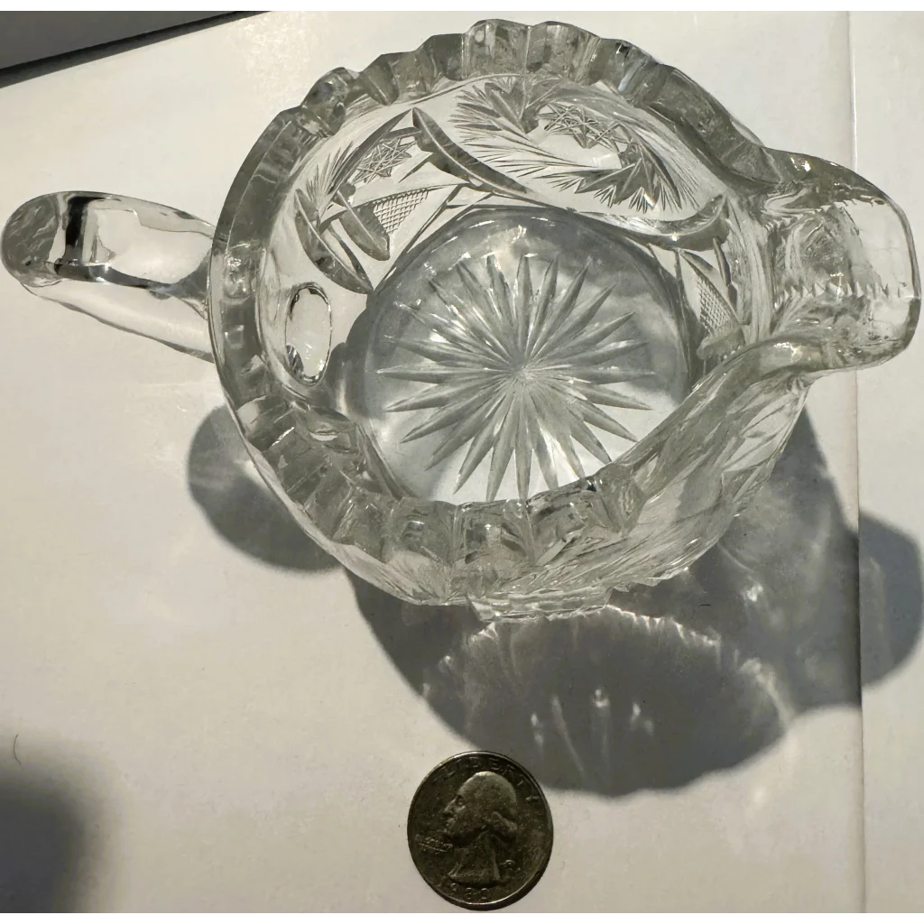 American brilliant cut glass creamer with ruffled rim and starburst pattern