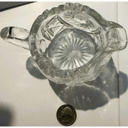 American brilliant cut glass creamer with ruffled rim and starburst pattern