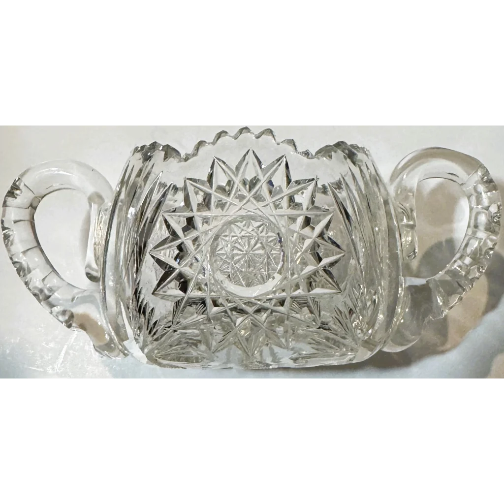 American brilliant cut glass sugar bowl with handles and sawtooth rim from the Gilded Age
