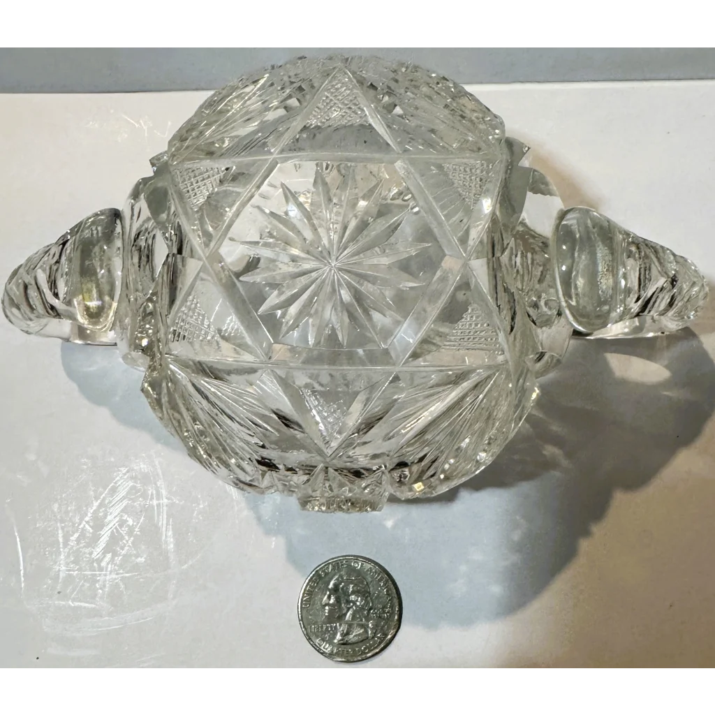 American brilliant cut glass sugar bowl with starburst pattern and handles