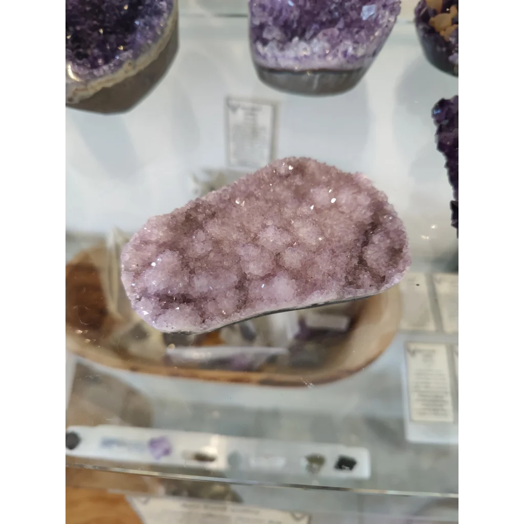 Stunning amethyst druze sculpture with polished purple crystals