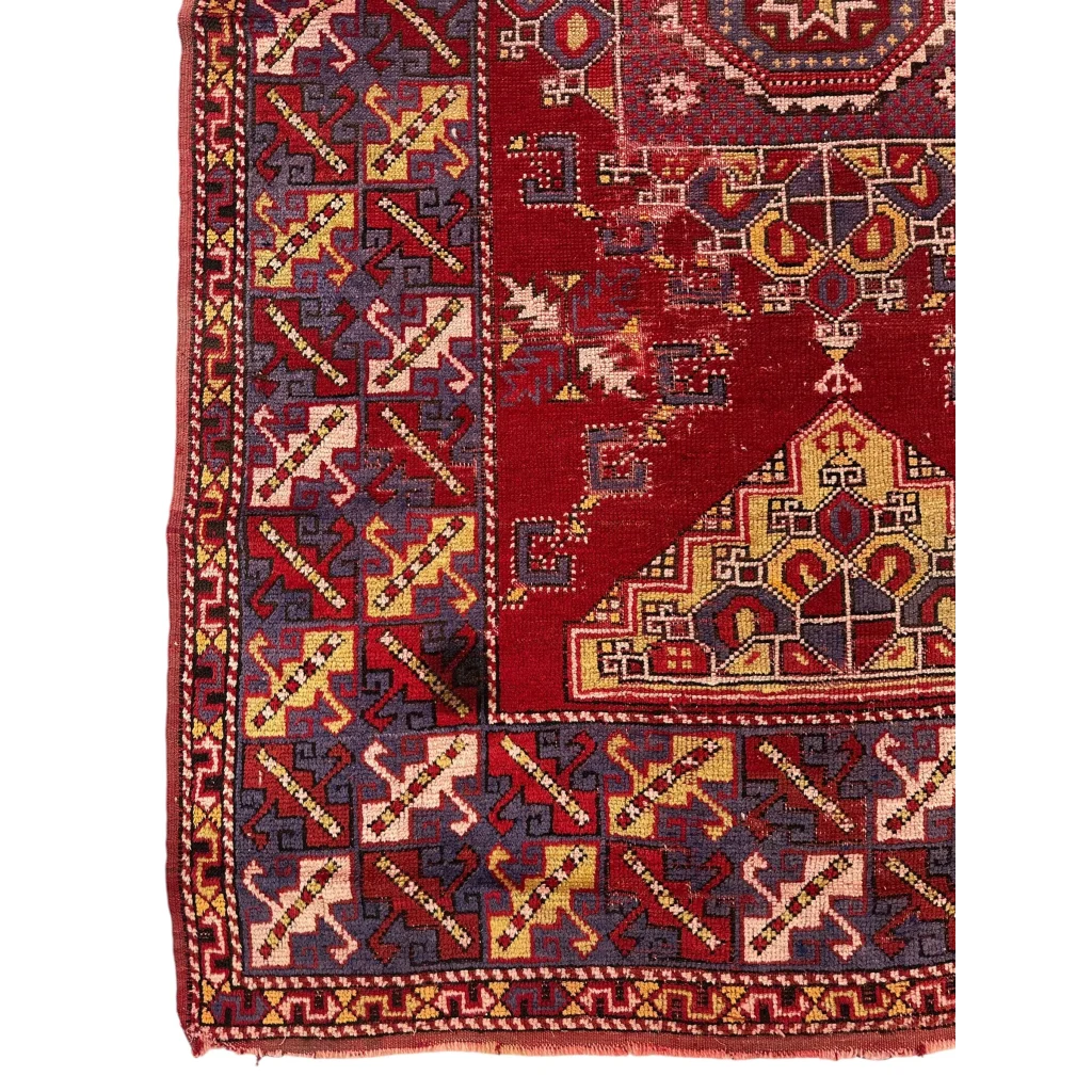 Vibrant Anatolian tribal rug with bold red medallion and intricate patterns